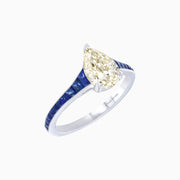 Pear-Shaped Diamond & Blue Sapphire Tapered Ring in Platinum 950 (1.01 CT Center Stone)