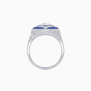Platinum Cushion Cut Diamond Ring with Calibre-Cut Sapphire Halo
