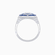 Midnight Bloom: Oval Diamond and Blue Sapphire Halo Ring in Platinum