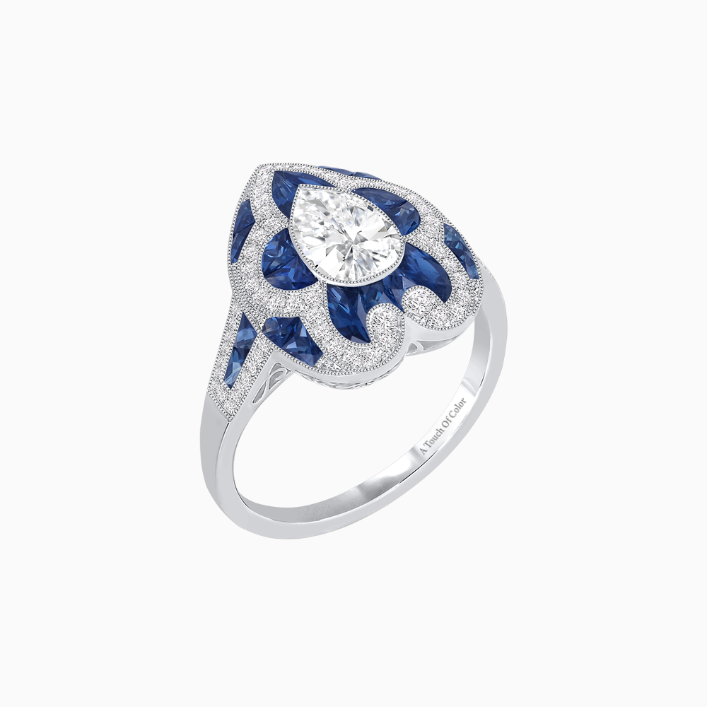 Platinum Pear-Shaped Diamond & Calibre Cut Sapphire Ring with Vintage-Inspired Milgrain Detailing