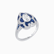 Platinum Pear-Shaped Diamond & Calibre Cut Sapphire Ring with Vintage-Inspired Milgrain Detailing