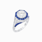 Art Deco–Inspired Platinum Diamond & Blue Sapphire Halo Ring with Handcrafted Milgrain