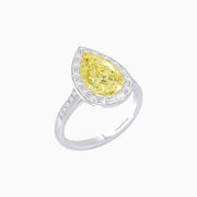 Platinum and 18K Yellow Gold Pear Shape Fancy Yellow Diamond Ring with Baguette Halo